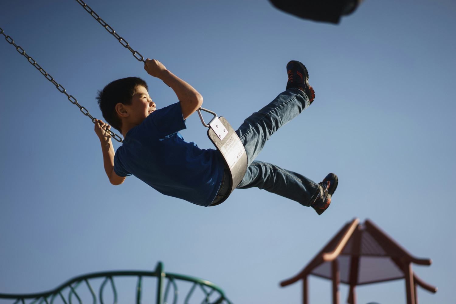 Young child on a swing.